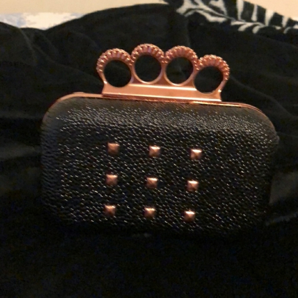 RIHANNA BLACK/ROSE GOLD CLUTCH. BRAND NEW.